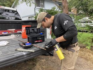 Mike of Mikes Plumbing Tacoma working at his truck on a job