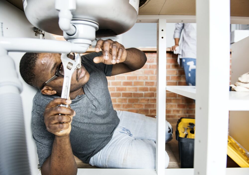 plumber-man-fixing-kitchen-sink